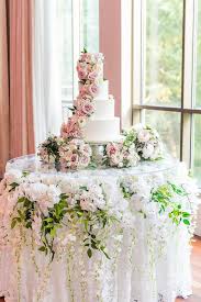 Maybe you would like to learn more about one of these? Elegant Wedding Cake Display With Orchids Wisteria And Greenery Draping Underneath Wedding Cake Display Wedding Cake Display Table Wedding Cakes With Flowers