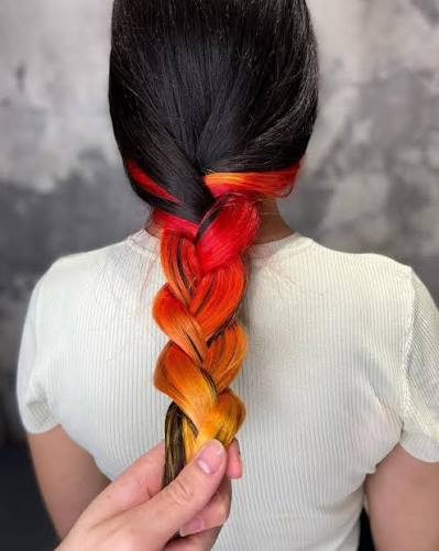 Just a little something hiding underneath 👀🔥 Obsessed with this peekaboo  color blend by @davit_hair using Super Red + Super Yellow.