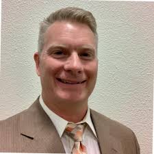 C-5 flying over an Aggie baseball game. With wingspan longer than the throw  from third base to first, it has a cargo capacity to fit both team buses  plus 4 more. Thanks