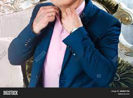 Wearing blue implied dignity and wealth, and blue clothing was restricted to the nobility. Man Blue Suit Pink Image Photo Free Trial Bigstock