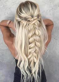 An elegant high bun is a great wedding hairstyle and this one has been taken to the next level with the addition of a four strand braid that has been wrapped around it. Braided Wedding Hairstyles For Long Hair Elisabetta Sebastio