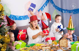Enjoy a specially prepared delicious holiday buffet and tap your feet to the beat to some of the best house entertainment, all while you cruise the savannah river. Smiling English Children Presenting Gifts During Christmas Dinner Stock Photo Picture And Royalty Free Image Image 147431528