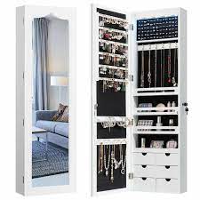 Not only will it keep your jewelry safe and out of harms way, but it puts them on display for you to easily view and organize. Lundt Led Wall Mounted Jewelry Armoire With Mirror Wall Mounted Jewelry Armoire Jewelry Mirror Jewelry Cabinet