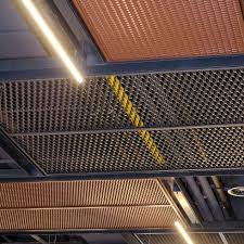 A Funky Bespoke Metal Mesh Ceiling At The Donauplex Leisure Complex In Vienna Coloured In Brown Re Barbershop Design Interior Barbershop Design Atrium Design