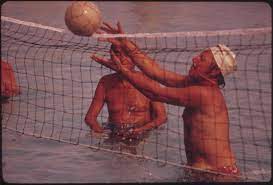 Beach volleyball is played with similar rules to indoor olympic volleyball, but with 2 players per side instead of six: Water Volleyball Wikipedia
