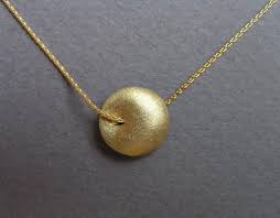 This is one purchase where spending more happens to be a good thing. 14k Gold Circle Necklace Puffy Bead Pendant Solid Gold Jewelry Dalia Shamir Jewelry