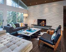 The wood floors the wood ceiling the fireplace the white linens and the window providing natural light in a fairly dark space. Slanted Ceiling Home Design And Decorating Ideas
