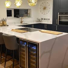 The bespoke kitchen features a huge slab of black granite work surface with a tactile brushed finish. What Are The Best Kitchen Worktop Materials Cambrian Granite