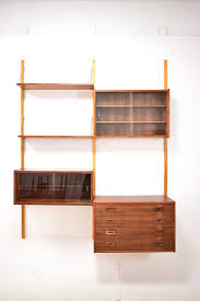 How many books are on a wood bookcase? Ps Shelving System Vintage Rosewood Randers Mobelfabrik