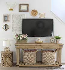 Your entertainment center most likely houses your tv, speakers or sound system, and a dvd player along with a couple of video game consoles. 18 Stunning Ways To Decorate Around A Tv Twelve On Main