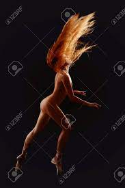 Dancing Naked Women Redhead Over Black Stock Photo, Picture and Royalty  Free Image. Image 23877843.