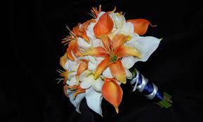 Colorful bridal bouquet with orange and cream roses, green button and spider mums, green hydrangea accented with black viburnum berries. Burnt Orange Cream Bridal Bouquet Destination Or Not