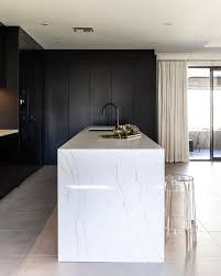 See kitchen island ideas for using bench seating to create an inviting dining space. F Amato Designs Gorgeous Island Bench Top With Precision Waterfall Edging Showing The Beautifu Waterfall Countertop Marble Kitchen Island Kitchen Island Tops
