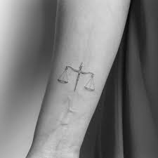 Curved lines and black ink makes it beautiful on the upper back. The Dreamiest Tiny Zodiac Tattoos On Instagram Livingly