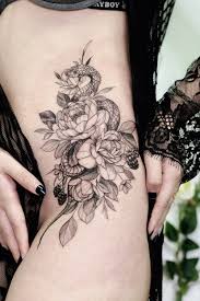 Skull and roses black tattoo on the left hip and thigh. Tattoo Uploaded By Vyxi Woo Tattooer Snake Flowers Hip Tattoo Done By Vyxiwoo Tattooer Vyxiwoo Tattooer Instagram Vyxiwoo Tattooer Singapore Singaporetattoos Vyxiwoo Vyxiwootattooer Snake Snaketattoo Hiptattoo Thightattoo Flowers