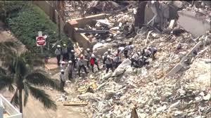 Rescue workers pick through rubble for survivors after a building collapse in florida. Wcoiqrnqxgxvm
