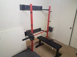 In the photo above the metal sheets to reinforce the joints aren't on yet) this one was built by redditor mr friz and cost approximately $50 us. Squat Rack That Folds Into The Wall Diy