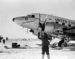 October 31, 1956 - Rear Admiral G.J. Dufek became the first person to land a plan at the South Pole. An R4D Skytrain was landed on the ice. RADM Dufek CAPT Dordiner,