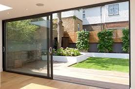 Simple Landscaped City Garden With Large Sliding Doors At The End Of The House Sliding Patio Doors Patio Doors Aluminium Sliding Doors