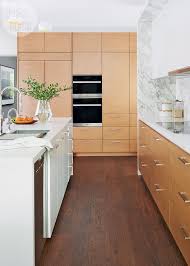 Mid century modern kitchen cabinets. A Mid Century Modern Kitchen With A Creative Storage Solution Style At Home Mid Century Modern Kitchen Design Mid Century Modern Kitchen Modern Kitchen Remodel