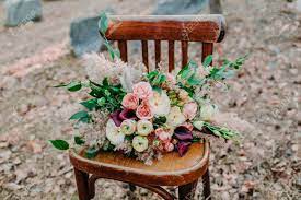 17 pieces package silk flower wedding decoration bridal bouquet pink brown lily. Beautiful Wedding Bouquet On An Old Brown Chair Standing Outside Stock Photo Picture And Royalty Free Image Image 81278142
