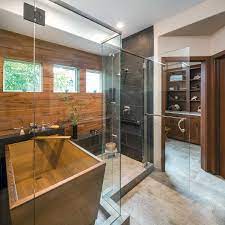 In the footprint where the tub stands, you'll likely have plenty of room to build a shower, but you'll want to add a tile or solid surface curb to keep the water from spilling out into the bathroom. Stylish Showers Tubs Kitchen Bath Design News