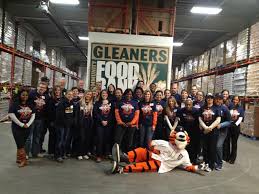 On November 13 Members Of The Detroit Tigers Front Office Staff Volunteered At The Gleaners Community Food Bank In Detroit Detroit Tigers Detroit Mascot