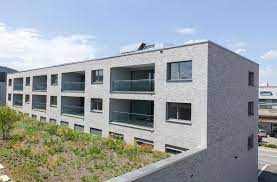 schaffung eines neuen quartiers im zentrum von munsingen mit ladenflachen und 47 wohnungen uber drei gebaude architektur rykartarchitekten liebefeld