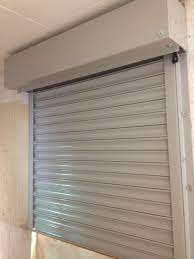 Rsg5000 Galvanised Steel Security Roller Shutter Fitted To One Of The Openings Of A Storeroom In Harrow Rolling Shutter Roller Shutters Shutter Doors