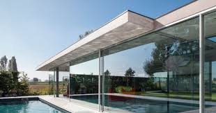 Lieven Dejaeghere S Glass Pool House Has A Concrete Roof Glass Pool Concrete Roof Modern Pools