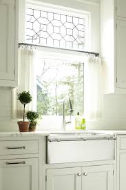 Gossip, deception and kitchen window treatments over sink. A Farm Sink In Stainless Is A Twist On The More Familiar White Fireclay Cultivate C Kitchen Window Treatments Interior Design Kitchen Kitchen Window Curtains