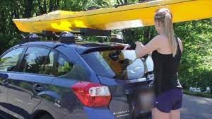 Position the kayak in your truck bed. Kayak Lift Assist Suction Mounted Roof Roller