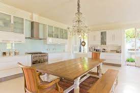 Maybe you would like to learn more about one of these? Chandelier Over Wooden Table In Kitchen Stockphoto