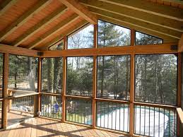 screen porches bring outdoor living into the night screened porch designs porch design porch flooring