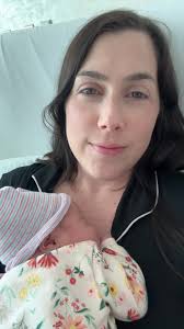 Sweet Baby Girl Newborn Snuggles with Mom