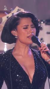 Here's RAYE: 🎶✨ A voice, a vision, and a show-stopping moment at the  #GRAMMYs.