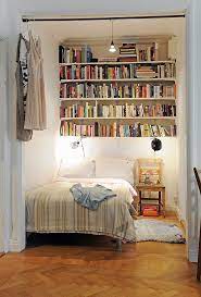 This living room emphasizes the fireplace by flanking it with inset bookshelves, complete with library ladders and library lights overhead. 21 Ikea Hacks Your Pets Will Appreciate Cozy Small Bedrooms Bedroom Nook Home Bedroom