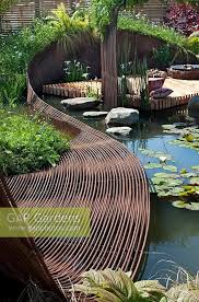 Pond Garden With Centrepiece Ribbon Of Woven Rebar Steel Deck Area For Sitting Wildflower Meadow Mat Of Nati Garden Architecture Garden Deco Landscape Design