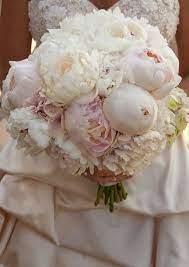 And when you put together a bouquet of peonies, you get a fluffy cloud of white, blush, coral or pink that's simply heavenly. Wedding Flowers Bridal Bouquet Wedding Bouquets My Wedding