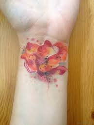 This tree water color tattoo is looking cool on upper back. 72 Fantastic Flower Tattoos For Wrist