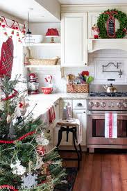 Farmhouse Style Kitchen With Red Accents And Boxwood Wreaths As Christmas Decor I Ve Never Seen Christmas Kitchen Decor Christmas Decor Diy Christmas Kitchen