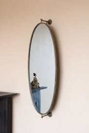 Why we love lighted vanity mirrors. Oval Swivel Wall Mirror Rockett St George