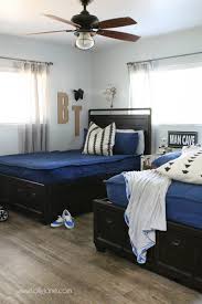 Try arranging twin beds in an l shape as pictured in this spacious and functional boys' room from decorating your small space. Boys Bedroom Decor Lolly Jane