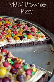 For frosting, melt butter and chocolate over very low heat; M M Brownie Pizza
