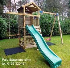 speelkasteel speelhuis met glijbaan en schommel schommel glijbaan tuin