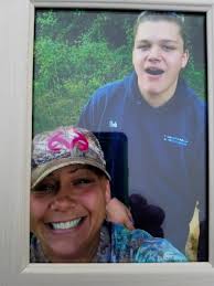 Family and friends remember Gaven J. Carlisle in candlelight vigil