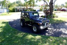 Image result for Brilliant Black 2005 Jeep