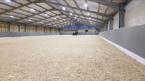There is an outdoor covered ice rink (the bubble), also located on the property, which is owned by the city and shares a refrigeration system with the main, indoor arena. Equine Construction Indoor Riding Arena Builders