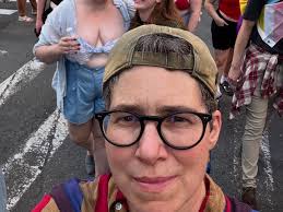 A beautiful fierce stream of dykes🪩🖤. My favorite “Let's Go Birding  Together”. Heart, heart, heart. It IS a revolution of love! #dykemarch2025