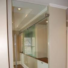 Concord white aluminum frame mirrored interior sliding door: Heavy Glass Frameless Doors Commercial Gallery Anchor Ventana